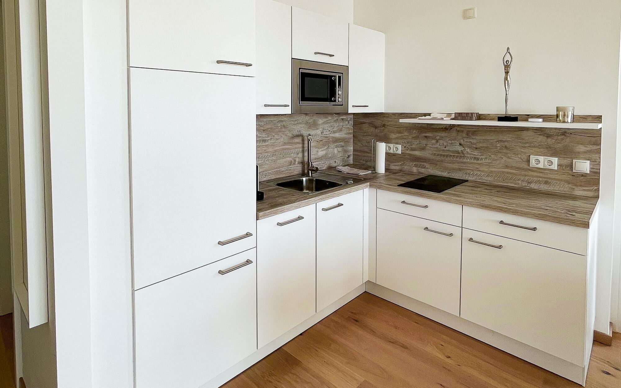 FEREIENWOHNUNG MIETEN SEEPARK OGGAU KÜCHE